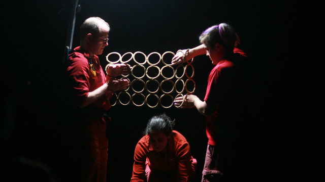 Campbell, Davies, and Durko Lynch perform tasks with props