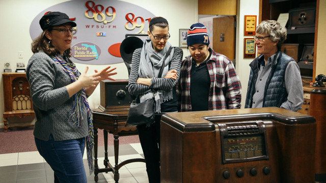 Suzanne Smith taking Jennifer Monson and collaborators on a production studio tour of WFSU TV