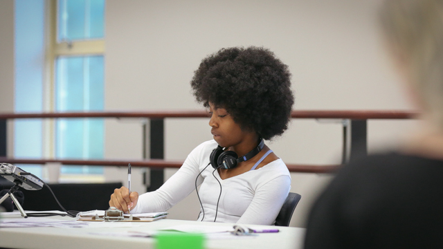 Jasmine Booker, FSU student, takes notes