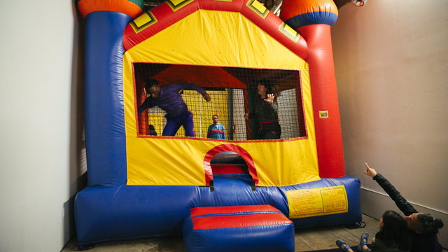 Performers inside bounce house at 621 Gallery