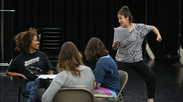 May and performers rehearse text