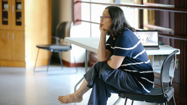 Uchizono observing dancers during rehearsal