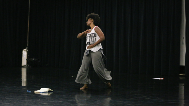 Melanie Greene at work on her writing and moving practice in the studio