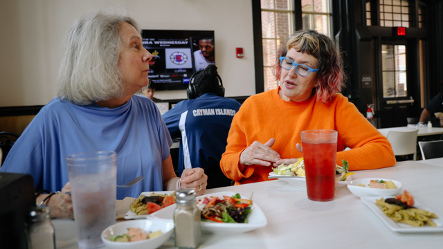 Graney speaking with FSU Professor of Psychology, Dr. Colleen Kelley