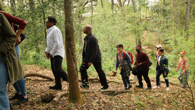 Audience walks to the site of Weeks' outdoor work-in-progress showing of <em>3 RITES: Liberty</em> on the  <br>property of Eleanor Dietrich