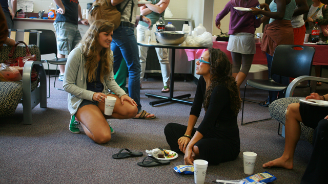 Rosie Herrera speaks with FSU student during post viewing luncheon.