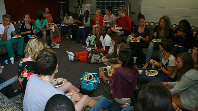 Students talk with Herrera and collaborators during post viewing luncheon.