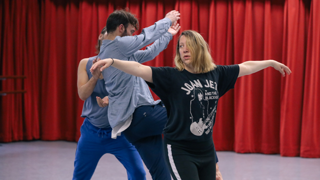 Jeffrey Wells, Sam Johnson, and Erin Search-Wells work through a movement score in-studio