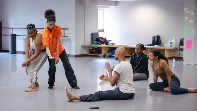 Hailes and Stiggers engage in process as Darrell Jones directs them through a movement practice while<br>Mozie and Bauman observe