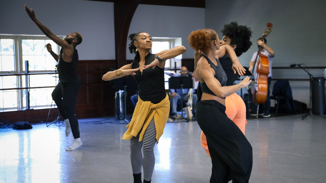 Demetia Hopkins, Kamryn Vaulx, and Brianna Rhodes (foreground)