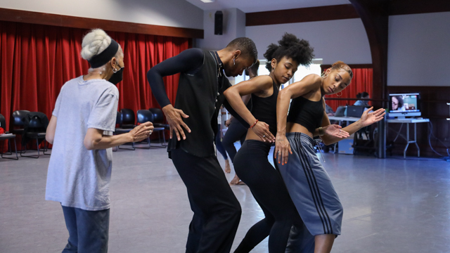 Ms. McIntyre working with dancers Shaquelle Charles, Brianna Rhodes, and Kamryn Vaulx