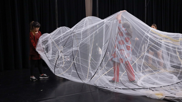 FSU graduate student Emily Gumal works with Visual Artist Lelis Brito on installing a set piece crafted at<br>MANCC