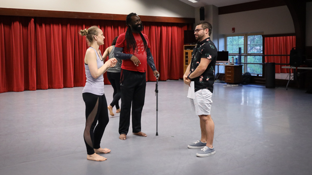 Zahna Simon and Antoine Hunter engage with a community member after the showing