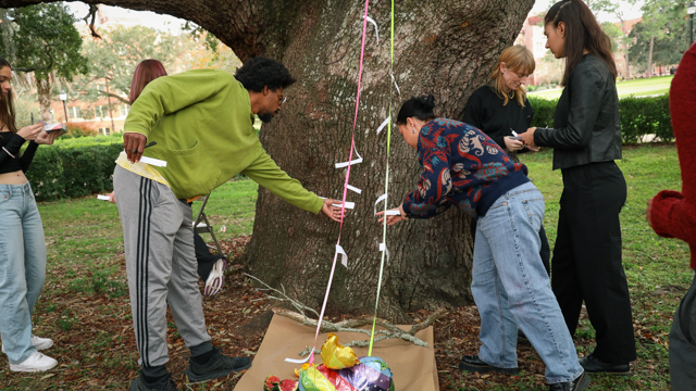 Jeremy Guyton, MANCC staff Mariah Preedin, and FSU students engage as a part of Iwashita's showing